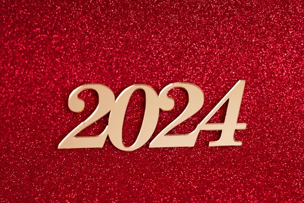 装飾的な碑文 2024 赤い輝く背景 新年のお祝いのコンセプト 選択的な焦点 ロイヤリティフリーのストック画像