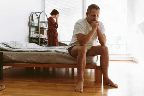 Middle Aged Man Sits End Bed Holds Head Argument Wife — Stock fotografie