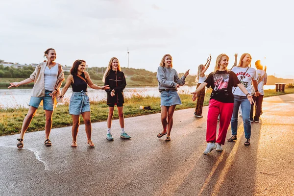 stock image Party middle-aged women, millennials, at sunset. Group dancing cheerful attractive happy women, summer, vacation, travel. dancing cheerful attractive women at sunset. 