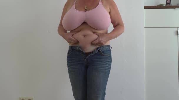 Unrecognizable Chubby Woman Small Size Jeans Pink Top Size Breasts — Stock Video
