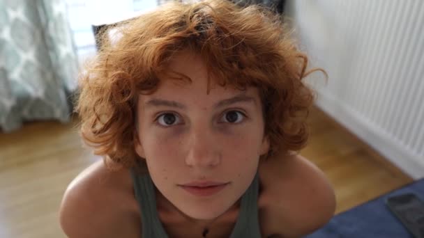 Attractive Red Haired Curly Teenage Girl Peers Looks Intently Camera — Stock Video