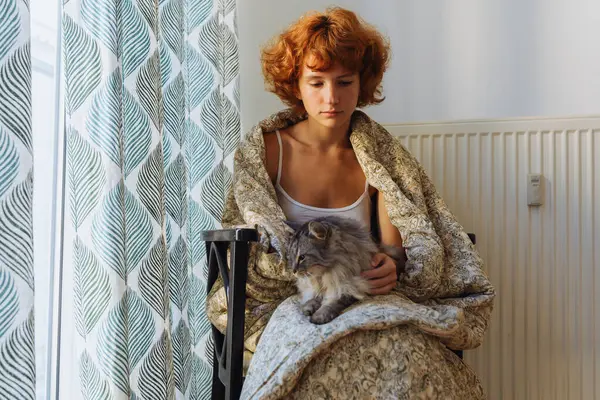 Girl Hugging Cat Sitting Blanket Home Frozen Teen Barefoot Red Stock Image