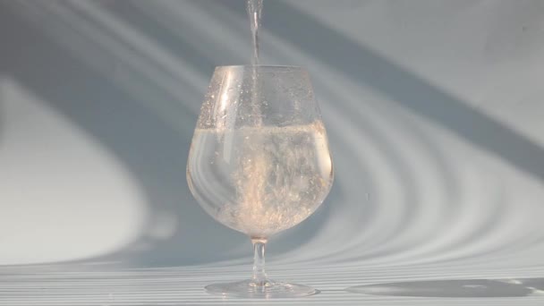 Process Pouring Water Glass Glass Water White Background Top View — Stock Video