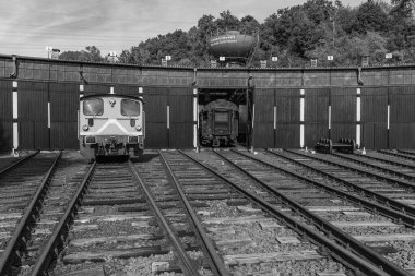 old locomotives and waggons in a historical surrounding clipart