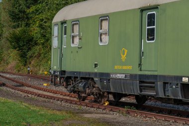 old locomotives and waggons in a historical surrounding clipart