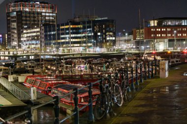 the city of Amsterdam at night clipart