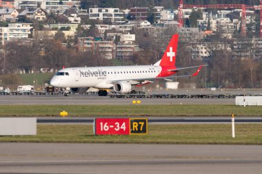 Zurich, Switzerland, January 19, 2023 Helvetic airways Embraer E-190 aircraft departing from runway 28