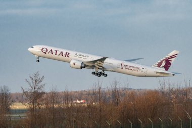 Zurich, Switzerland, January 19, 2023 Qatar airways Boeing 777-367ER aircraft is taking off from runway 28
