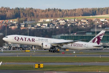 Zurich, Switzerland, January 19, 2023 Qatar airways Boeing 777-367ER aircraft is taking off from runway 28