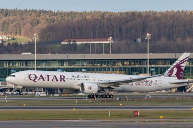 Zurich, Switzerland, January 19, 2023 Qatar airways Boeing 777-367ER aircraft is taking off from runway 28