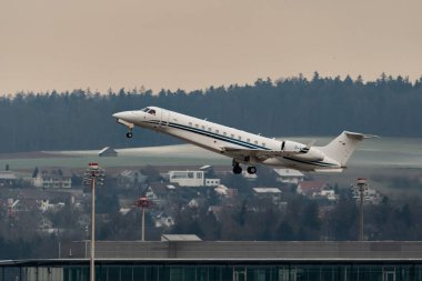 Zurich, Switzerland, January 20, 2023 Embraer Legacy 650E business aircraft takeoff from runway 28 after the world economic forum in Davos
