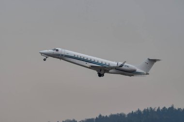 Zurich, Switzerland, January 20, 2023 Embraer Legacy 650E business aircraft takeoff from runway 28 after the world economic forum in Davos