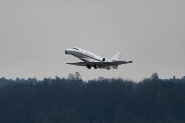 Zurich, Switzerland, January 20, 2023 Cessna Citation Latitude business aircraft is taking off from runway 28 after the world economic forum in Davos