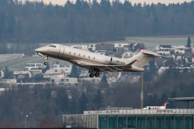 Zurich, Switzerland, January 20, 2023 Bombardier Challenger 350 business aircraft is taking off from runway 28 after the world economic forum in Davos