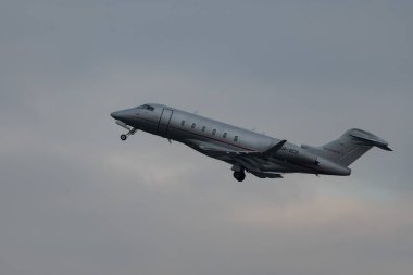 Zurich, Switzerland, January 20, 2023 Bombardier Challenger 350 business aircraft is taking off from runway 28 after the world economic forum in Davos
