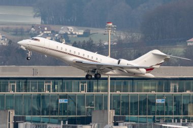 Zurich, Switzerland, January 20, 2023 Bombardier Global 6500 business aircraft takeoff from runway 28 after the world economic forum in Davos