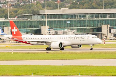 Zurich, Switzerland, September 27, 2022 Helvetic airways Embraer E195-E2 aircraft is taxiing to its final position at the international airport