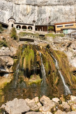Saint Beatus, Canton Bern, Switzerland, February 12, 2023 Beautiful waterfall scenery in the entrance area of the Saint Beatus caves