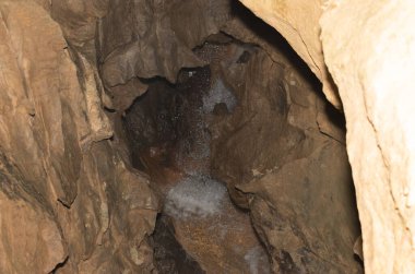 Saint Beatus, Canton Bern, Switzerland, February 12, 2023 Fantastic waterfall scenery surrounded with an incredible rock formation inside the Saint Beatus caves