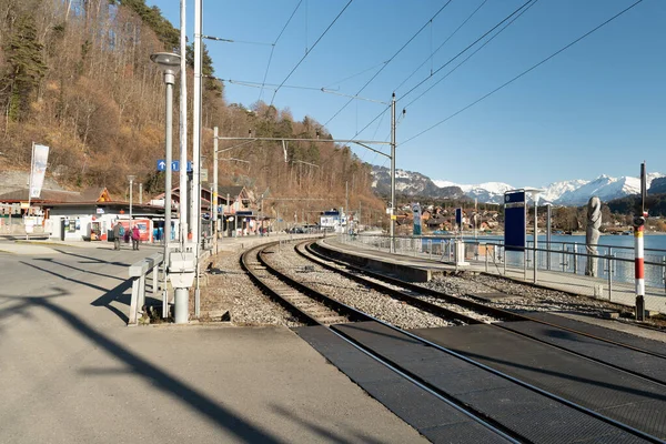 Brienz, Switzerland, February 10, 2023 View along the railway and the train station at the coast of the lake of Brienz
