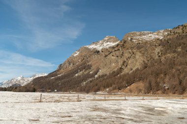 Silvaplana, Switzerland, February 21, 2023 Snow covered alpine scenery on a sunny day
