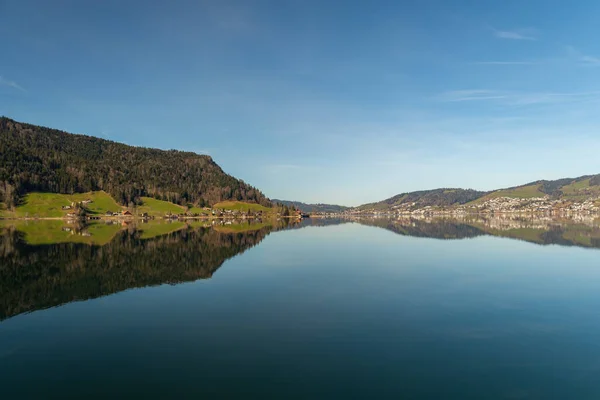 stock image Oberaegeri, Switzerland, February 20, 2023 Fantastic landscape panorama at the Aegerisee on a sunny day