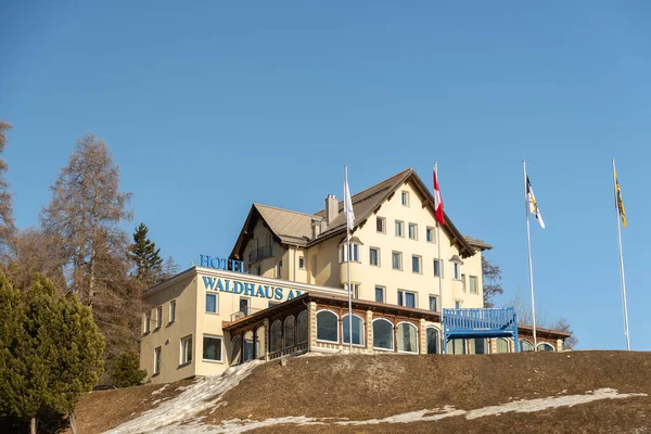 stock image Saint Moritz, Switzerland, February 21, 2023 Building of the hotel Waldhaus am See on a little hill