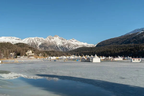 stock image Saint Moritz, Switzerland, February 21, 2023 Frozen lake of Saint Moritz and a magnificent alpine panorama on a sunny day