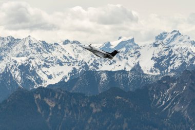 Rhine Valley, Saint Gallen, Switzerland, May 20, 2023 T7-CBW Embraer EMB-500 Phenon 100 aircraft performance during an air display seen from the top of the mount hoher Kasten clipart
