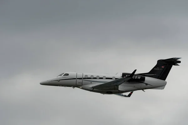 stock image Rhine Valley, Saint Gallen, Switzerland, May 20, 2023 T7-CBW Embraer EMB-500 Phenon 100 aircraft performance during an air display seen from the top of the mount hoher Kasten