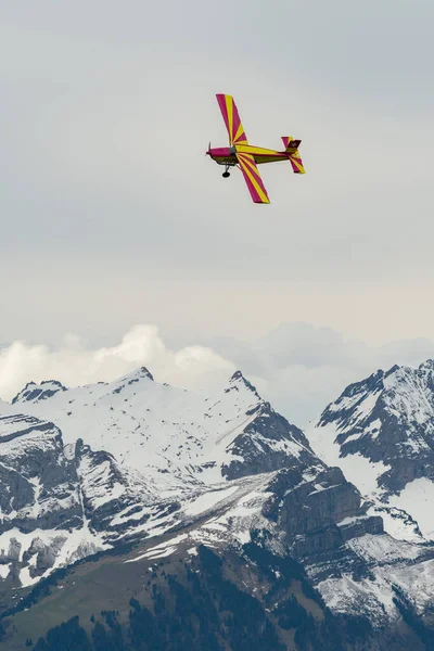 Stock image Rhine Valley, Saint Gallen, Switzerland, May 20, 2023 N-283SW Pilatus PC-6/350-H2 Porter propeller airplane performance during an air show seen from the top of the mount hoher Kasten