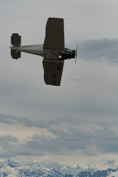 stock image Rhine Valley, Saint Gallen, Switzerland, May 20, 2023 HB-RIO Junkers F13 rebuilt nostalgic propeller airplane performance during an air show seen from the top of the mount hoher Kasten