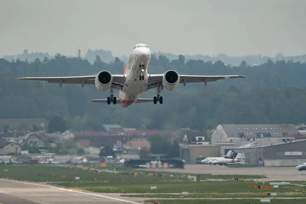 stock image Zurich, Switzerland, May 2, 2023 HB-AZF Helvetic Airways Embraer E190-E2 aircraft departing from runway 28