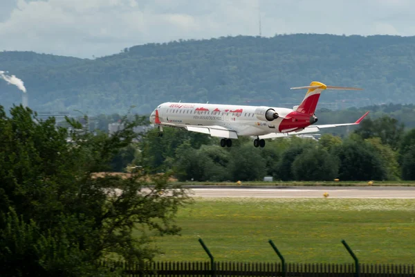 stock image Zurich, Switzerland, July 13, 2023 EC-MRI Iberia Mitsubishi CRJ-1000 aircraft is landing on runway 14