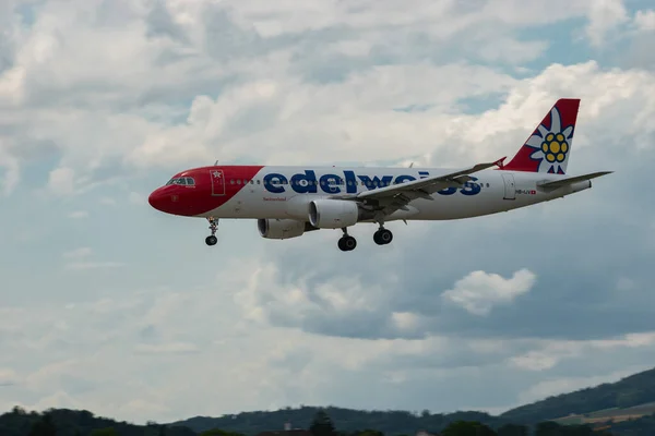 Stock image Zurich, Switzerland, July 13, 2023 HB-IJV Edelweiss Air Airbus A320-214 aircraft is landing on runway 14