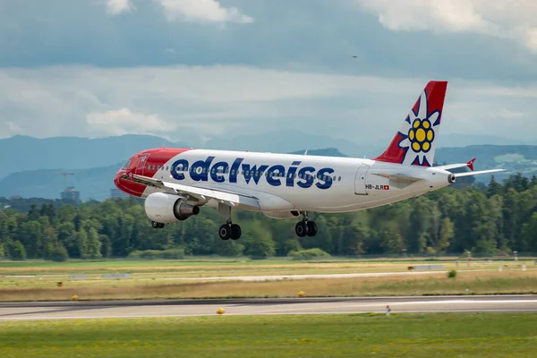 stock image Zurich, Switzerland, July 13, 2023 HB-JLR Edelweiss Air Airbus A320-214 aircraft is landing on runway 14