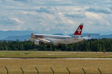 Zurich, Switzerland, June 16, 2024 HB-JCH Swiss international airlines Bombardier CS-300 or Airbus A220 aircraft is landing on runway 14 clipart