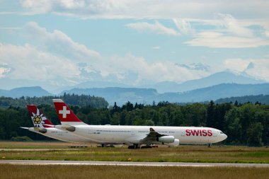 Zurich, Switzerland, June 16, 2024 HB-JMB Swiss international airlines Airbus A340-313 aircraft is lining up on runway 16 clipart