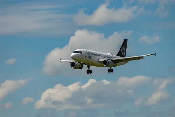 stock image Zurich, Switzerland, June 16, 2024 SAS Scandinavian Airlines Star Alliance Airbus A319-131 aircraft is landing on runway 14