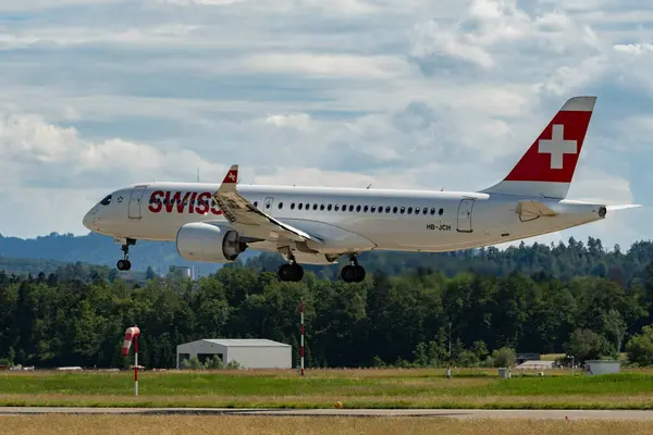 stock image Zurich, Switzerland, June 16, 2024 HB-JCH Swiss international airlines Bombardier CS-300 or Airbus A220 aircraft is landing on runway 14