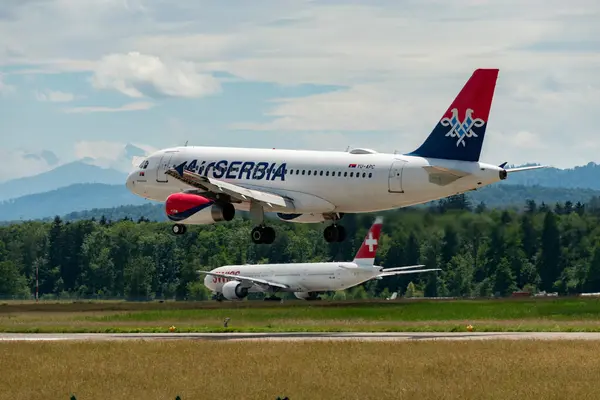 stock image Zurich, Switzerland, June 16, 2024 YU-APC Air Serbia Airbus A319-131 Novak Djokovic aircraft is landing on runway 14