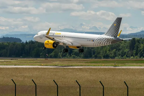 stock image Zurich, Switzerland, June 16, 2024 EC-NDB Vueling Airbus A320-271N aircraft is landing on runway 14