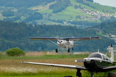 Wangen-Lachen, Switzerland, May 26, 2024 N-9236Y Maule MX-7-160 propeller plane is departing from a small airfield clipart