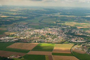 Altoetting, Germany, August 4, 2024 View over the city center during a flight in a small plane clipart