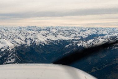 Sonthofen area, Germany, September 29, 2024 Majestic snow covered alpine scenery during a flight in a small plane clipart