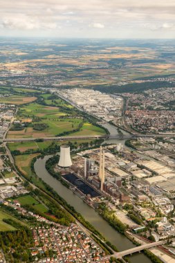 Neckarsulm, Germany, September 15, 2024 View over a power plant tower during a flight in a small plane clipart