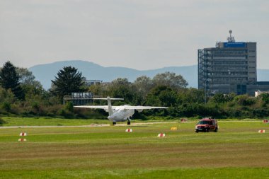 Mannheim, Germany, September 15, 2024 Dornier 328-120 propeller plane is departing from the local airport clipart