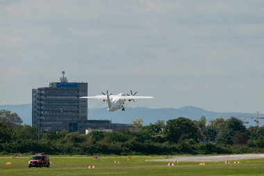 Mannheim, Germany, September 15, 2024 Dornier 328-120 propeller plane is departing from the local airport clipart