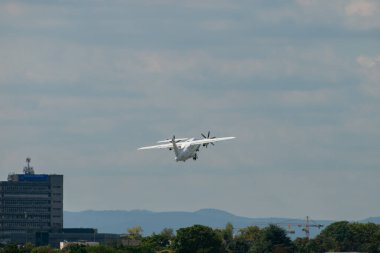 Mannheim, Germany, September 15, 2024 Dornier 328-120 propeller plane is departing from the local airport clipart