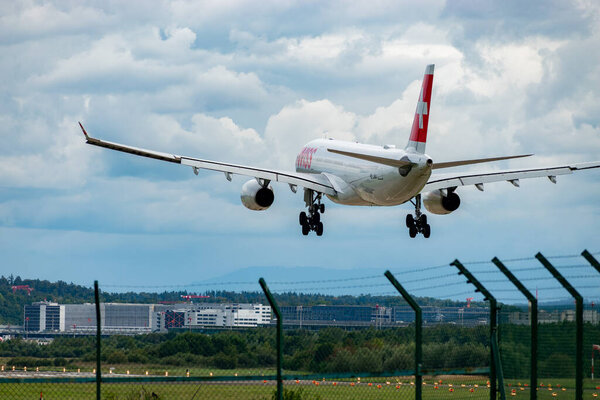 Zurich, Switzerland, September 14, 2024 HB-JHA Swiss international airlines Airbus A330-343 aircraft is landing on runway 14 on a cloudy day